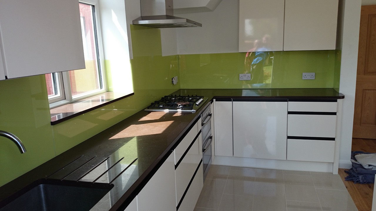 Lime green glass kitchen splashback installed by Wembley glaziers