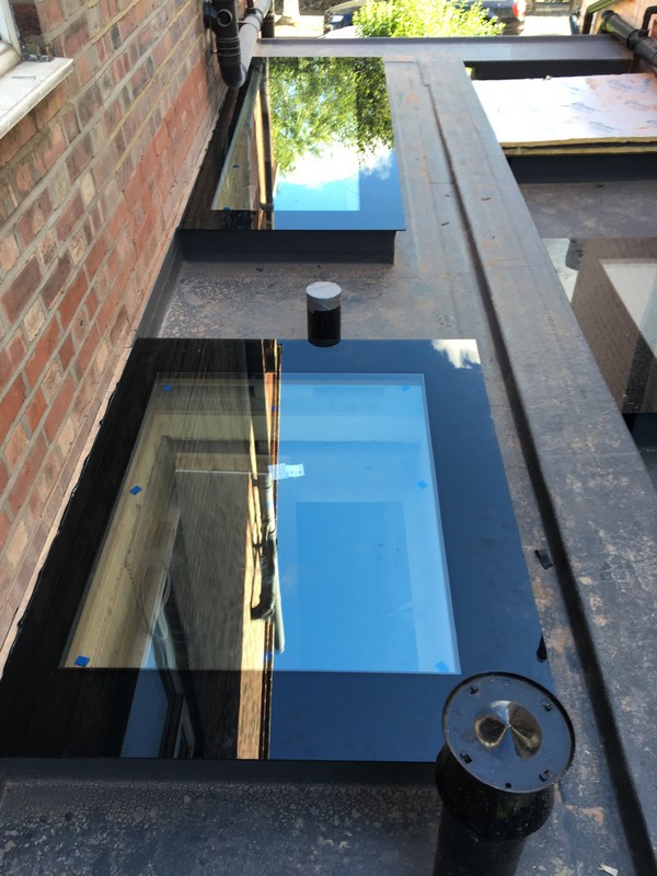Multiple flat roof skylights on extension in Wembley