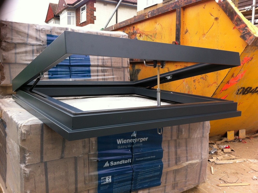 Opening flat roof skylight in anthracite grey installed in Wembley